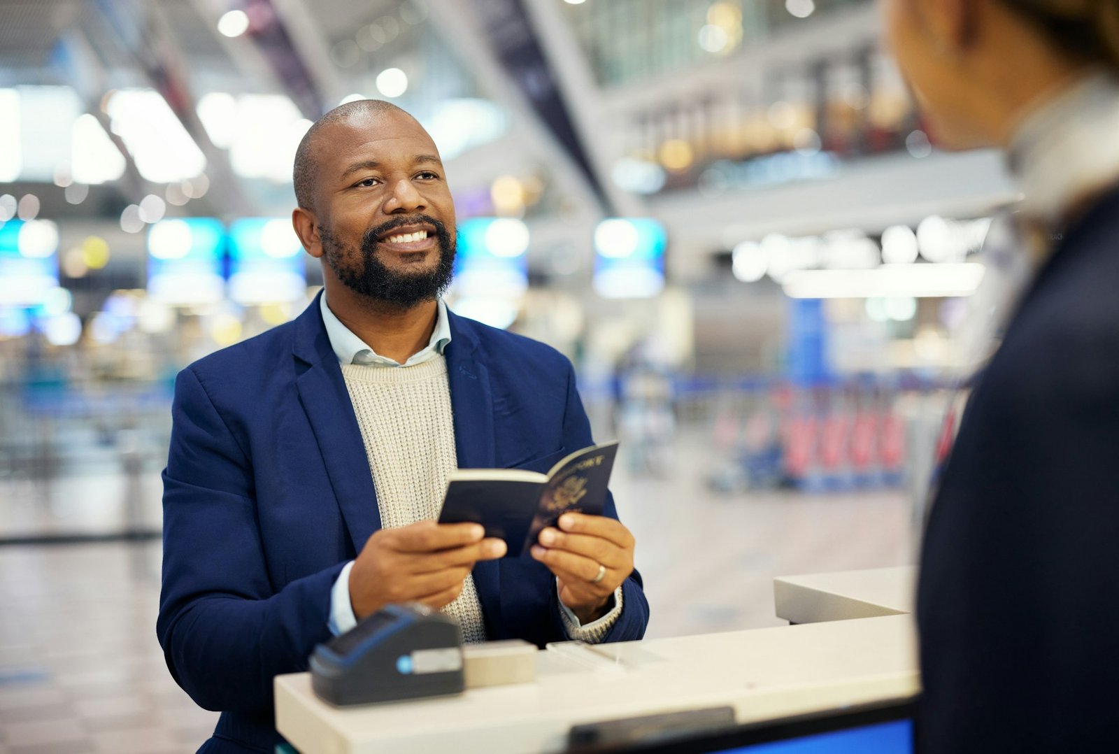 Black man, passport and airport desk for travel, security and identity for global transportation se